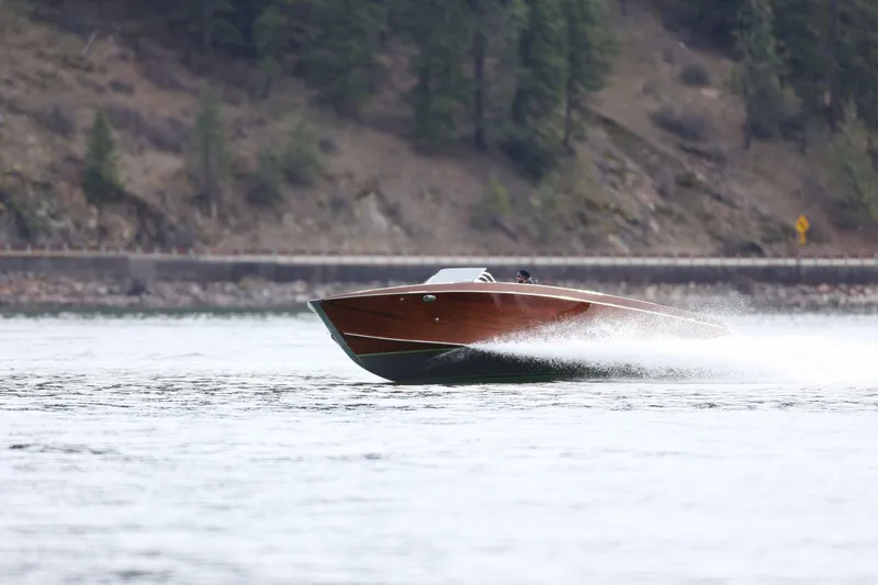 Slide: The Image of 2025 StanCraft 290 Rivelle speedboat cruising on a scenic lake. - 4
