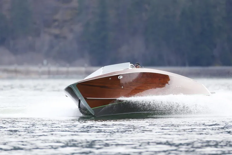 Slide: The Image of 2025 StanCraft 290 Rivelle speedboat cruising on a serene lake. - 6