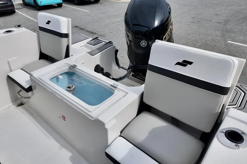 Slide: The Image of 2026 Starcraft SVX 191 OB CC boat interior with seating and motor. - 10