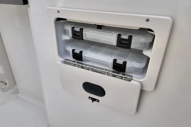 Slide: The Image of Storage compartment with tackle boxes on 2026 Starcraft SVX 191 OB CC boat. - 14