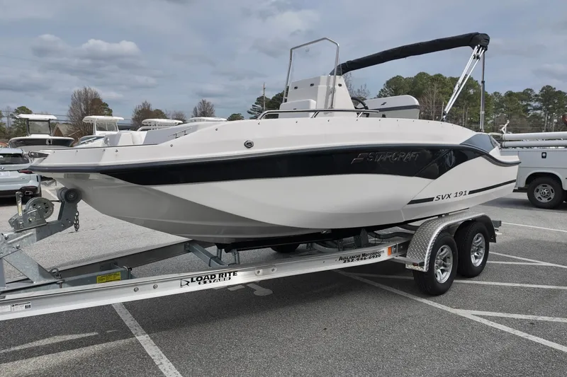 Slide: The Image of 2026 Starcraft SVX 191 OB CC boat on a Load Rite trailer in a parking lot. - 4