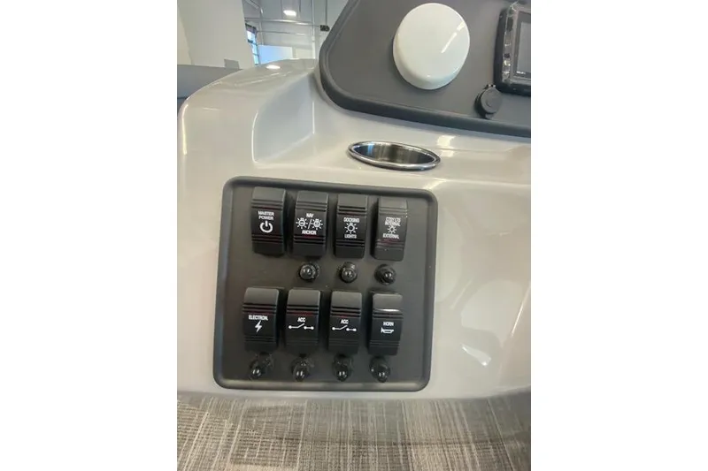Slide: The Image of 2026 Bentley Pontoons Bolt control panel with various switches and buttons. - 13