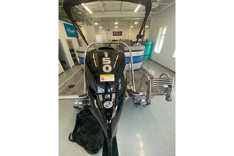 Slide: The Image of 2026 Bentley Pontoons Bolt with 150 HP engine in showroom. - 3