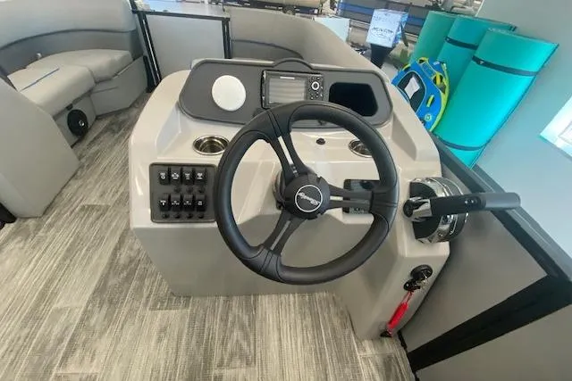 Slide: The Image of 2026 Bentley Pontoons Bolt steering console with modern controls and seating. - 6