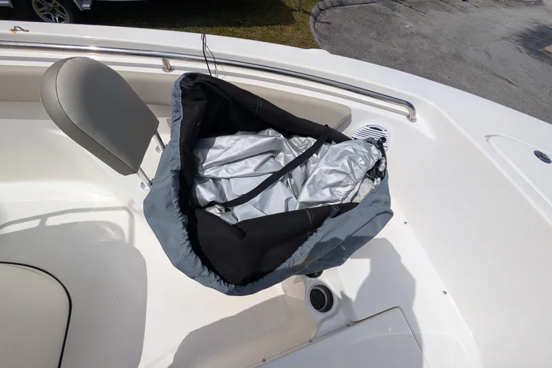 Slide: The Image of 2023 Key West 203 FS boat interior with seat and storage bag. - 17