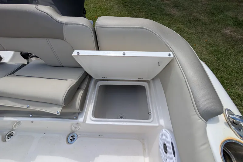 Slide: The Image of 2023 Key West 203 FS boat seat with open storage compartment, gray upholstery. - 7