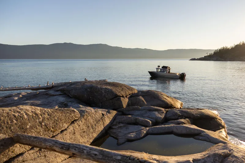Slide: The Image of Bow view of 2026 Jasper Marine Defender 22 with Garmin equipment at sunset. - 19