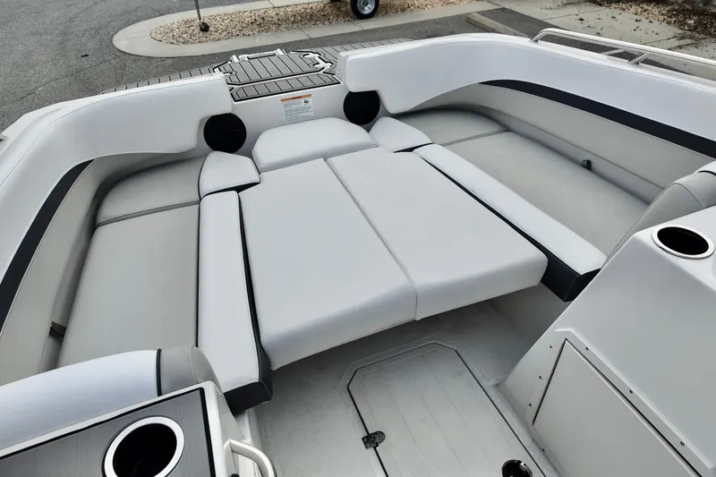 Slide: The Image of 2026 Starcraft SVX 191 OB boat interior with spacious seating and cup holders. - 10