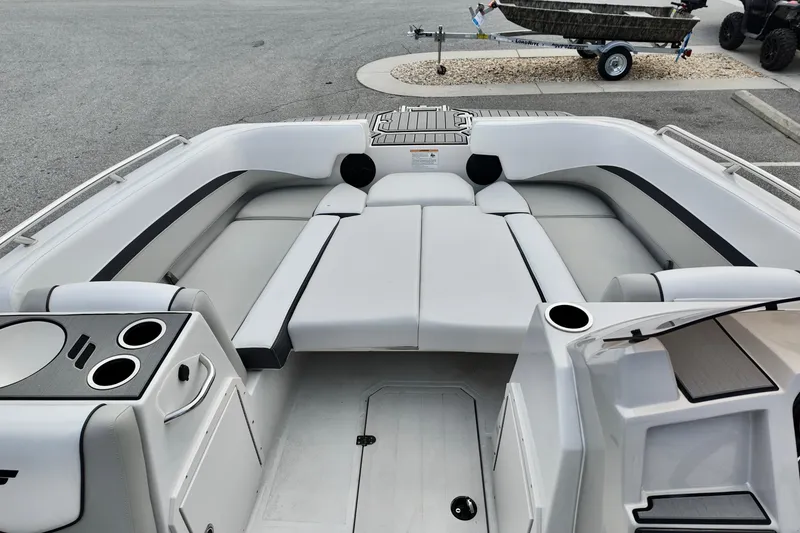 Slide: The Image of 2026 Starcraft SVX 191 OB boat interior with spacious seating and cup holders. - 11