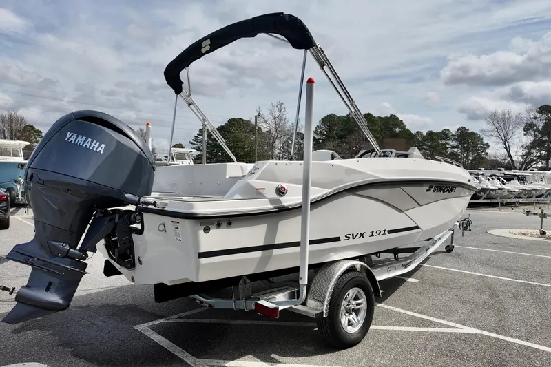 Slide: The Image of 2026 Starcraft SVX 191 OB boat with Yamaha engine on trailer in parking lot. - 12