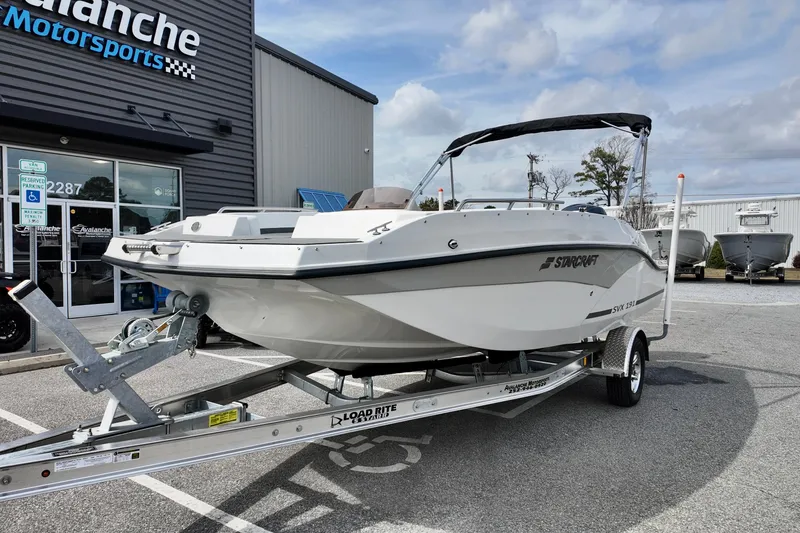 Slide: The Image of 2026 Starcraft SVX 191 OB boat on trailer outside dealership. - 15