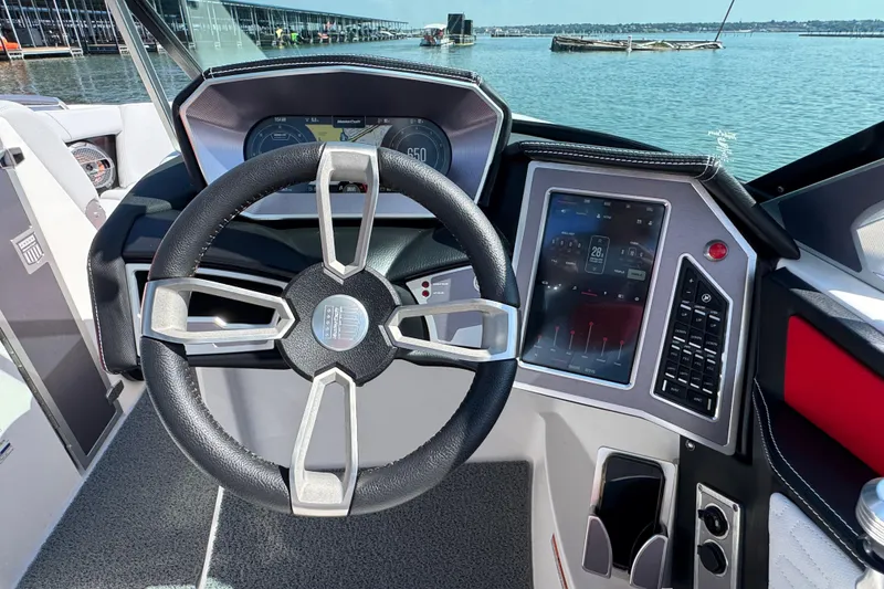 Slide: The Image of Steering wheel and dashboard of 2021 MasterCraft X22 boat on a sunny day. - 13