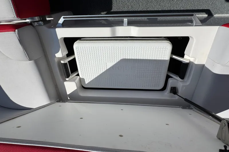 Slide: The Image of 2021 MasterCraft X22 boat storage compartment with integrated cooler. - 28