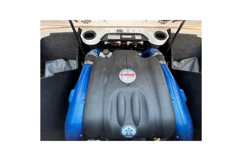 Slide: The Image of Engine of 2021 MasterCraft X22 boat with Ilmor branding, featuring blue components. - 32
