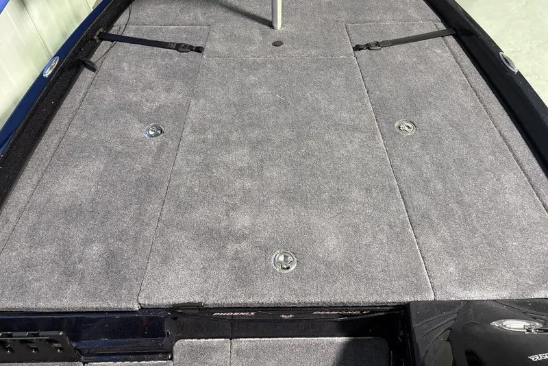 Slide: The Image of 2026 Phoenix 721 ZXL boat deck with gray carpet and storage compartments. - 11