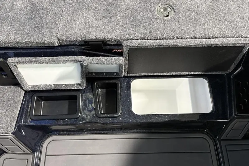 Slide: The Image of Interior compartments of 2026 Phoenix 721 ZXL boat, featuring storage and utility spaces. - 17