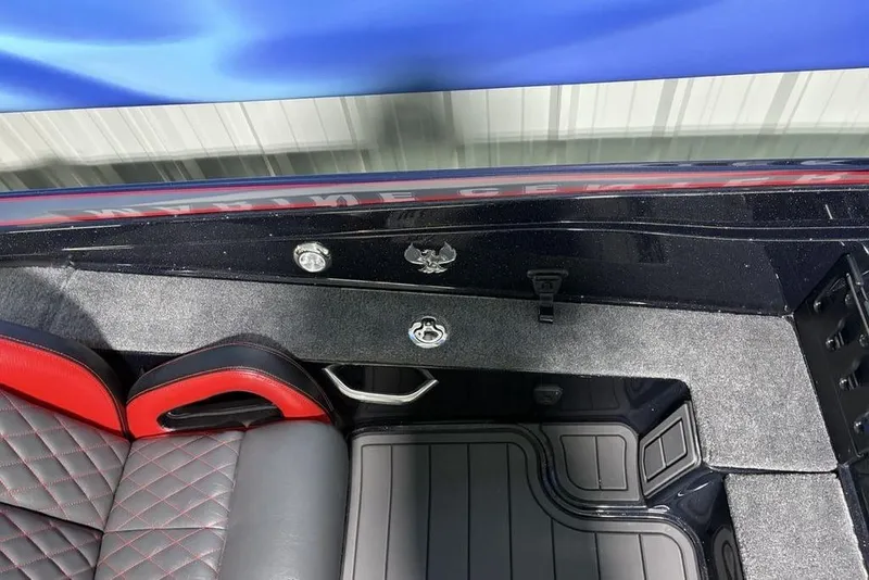 Slide: The Image of Interior of 2026 Phoenix 721 ZXL boat with red and black seating. - 18