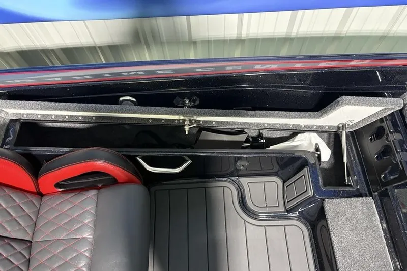 Slide: The Image of Interior of 2026 Phoenix 721 ZXL boat with storage compartment and red-black seats. - 19