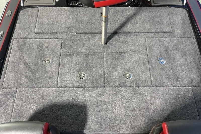 Slide: The Image of 2026 Phoenix 721 ZXL boat deck with gray carpet and storage compartments. - 24