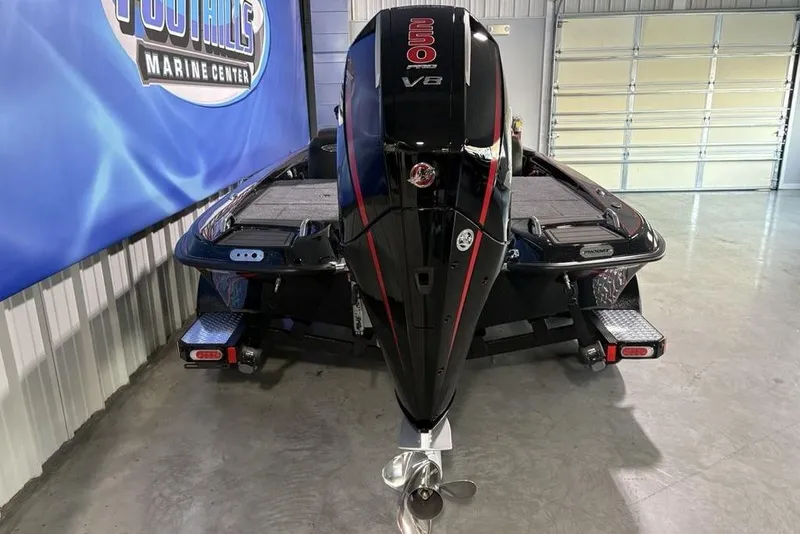 Slide: The Image of 2026 Phoenix 721 ZXL boat with powerful V8 engine in showroom. - 3