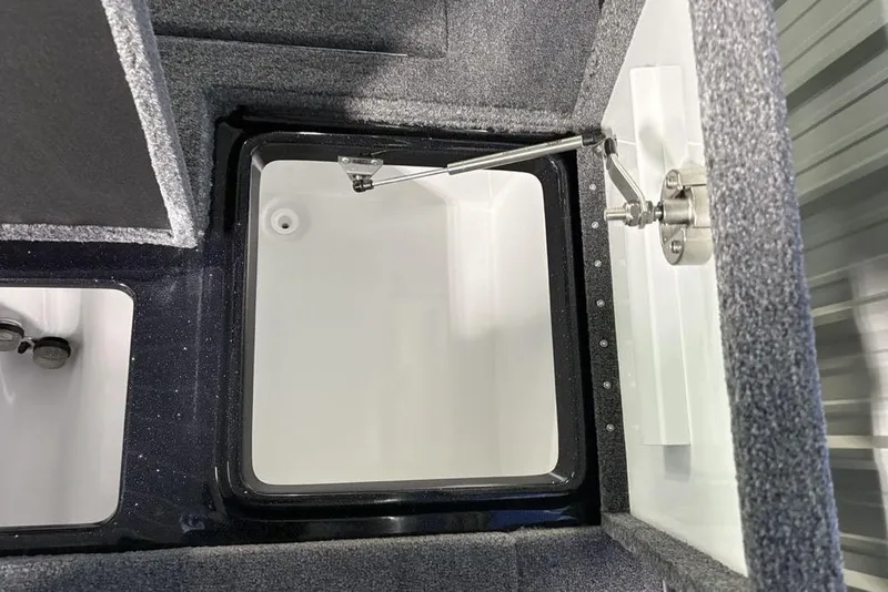 Slide: The Image of 2026 Phoenix 721 ZXL boat storage compartment with carpeted interior and hydraulic lift. - 31