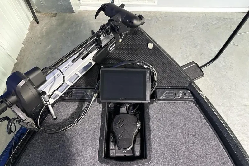 Slide: The Image of 2026 Phoenix 721 ZXL boat dashboard with Garmin display and Minn Kota trolling motor. - 6