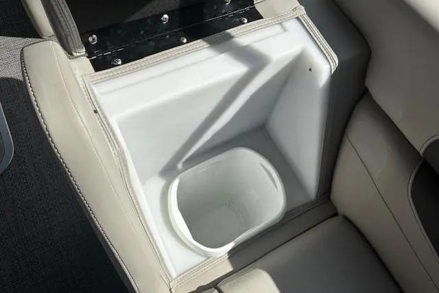 Slide: The Image of 2024 Barletta Cabrio 24CC boat cup holder with beige seating. - 11
