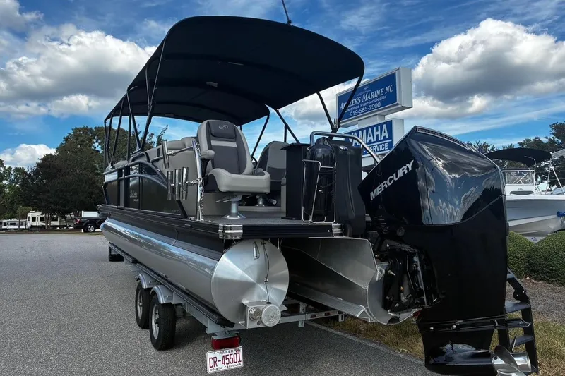 Slide: The Image of 2024 Barletta Cabrio 24CC pontoon boat with Mercury engine on trailer. - 3