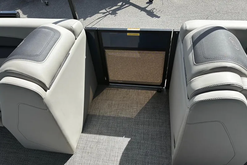 Slide: The Image of 2024 Barletta Cabrio 24CC interior seating with gray upholstery and carpeted flooring. - 7