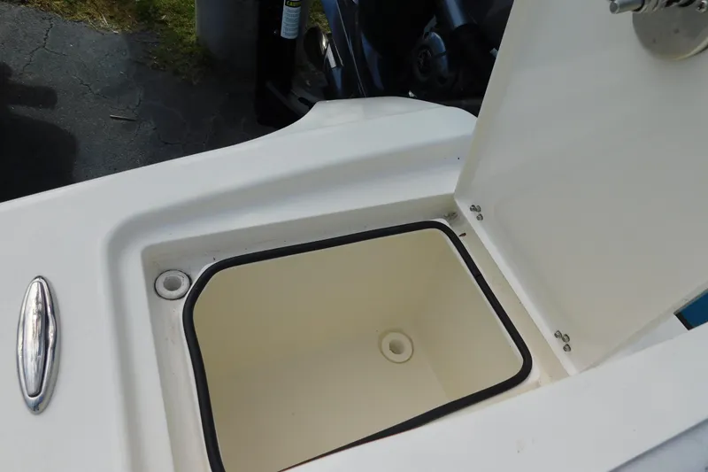 Slide: The Image of Open storage compartment on 2025 Pathfinder 2500 Hybrid boat, showcasing interior design. - 11