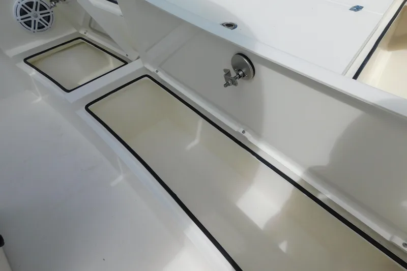 Slide: The Image of 2025 Pathfinder 2500 Hybrid boat storage compartments and speaker detail. - 17