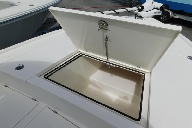 Slide: The Image of Open storage compartment on 2025 Pathfinder 2500 Hybrid boat deck. - 18