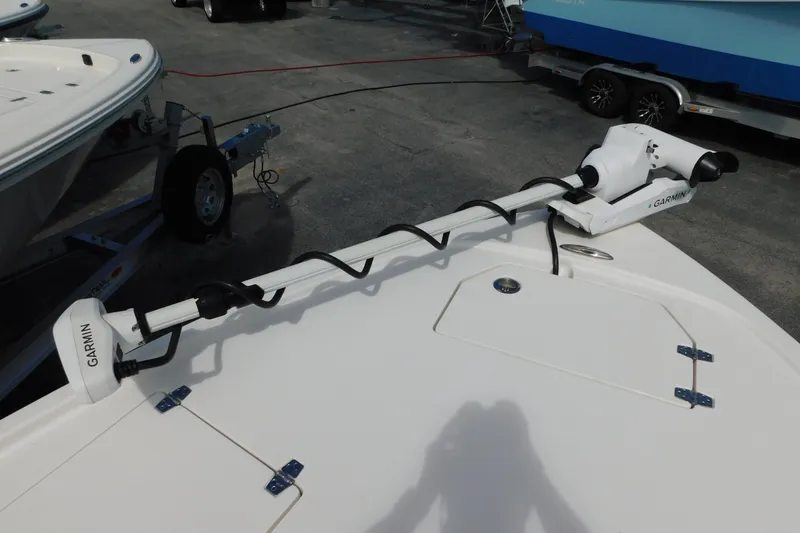 Slide: The Image of 2025 Pathfinder 2500 Hybrid boat with Garmin trolling motor on deck. - 19