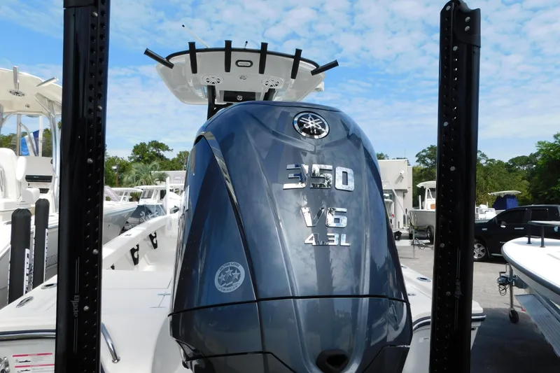 Slide: The Image of 2025 Pathfinder 2500 Hybrid boat with Yamaha 350 V6 engine, docked outdoors. - 25