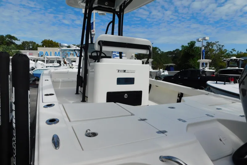 Slide: The Image of 2025 Pathfinder 2500 Hybrid boat at a dealership under a blue sky. - 27