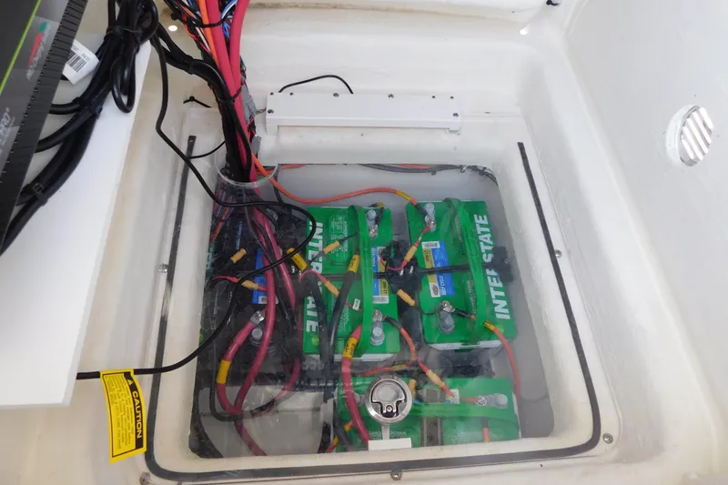 Slide: The Image of Battery compartment of 2025 Pathfinder 2500 Hybrid with Interstate batteries and wiring. - 28
