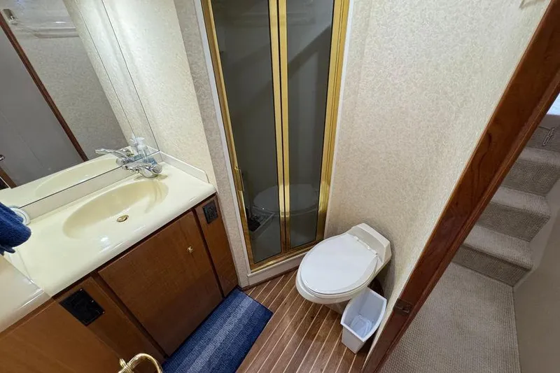 Slide: The Image of Bathroom interior of 2002 Viking 61 Enclosed Bridge yacht with shower and toilet. - 114