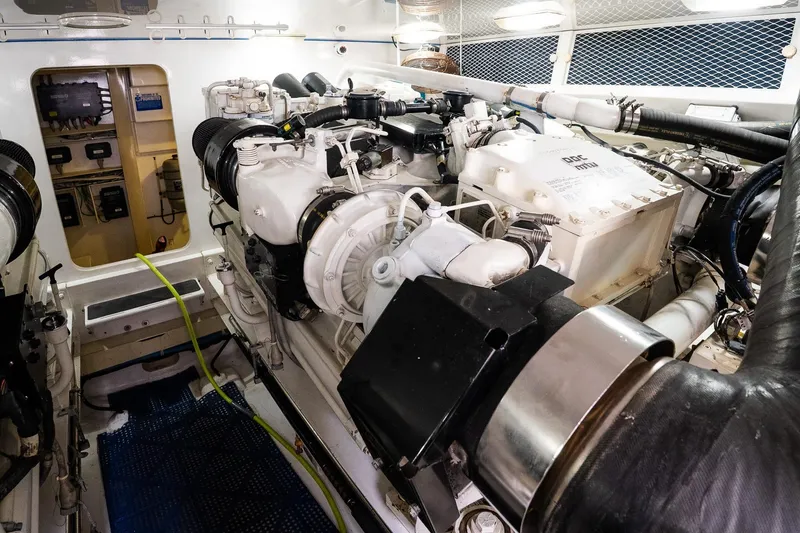 Slide: The Image of Engine room of 2002 Viking 61 Enclosed Bridge yacht, featuring advanced machinery and equipment. - 119