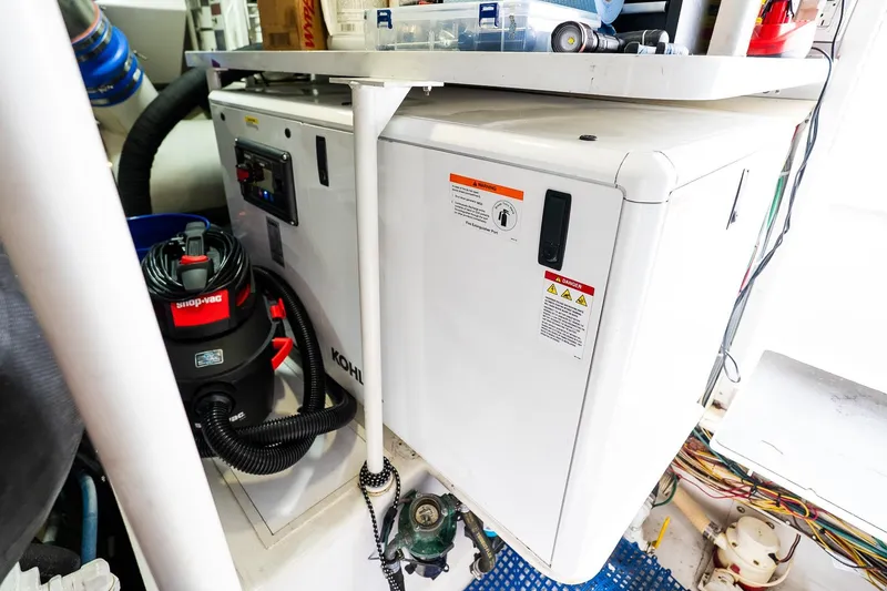 Slide: The Image of Engine room of 2002 Viking 61 Enclosed Bridge with equipment and wiring. - 123