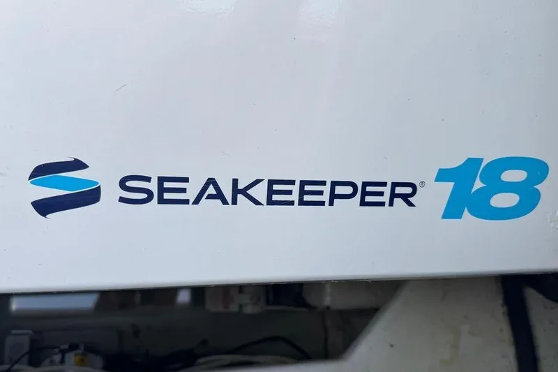 Slide: The Image of Seakeeper 18 logo on 2002 Viking 61 Enclosed Bridge yacht. - 125