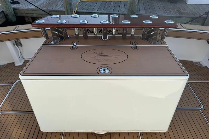 Slide: The Image of 2002 Viking 61 Enclosed Bridge yacht deck with fishing rod holders. - 17