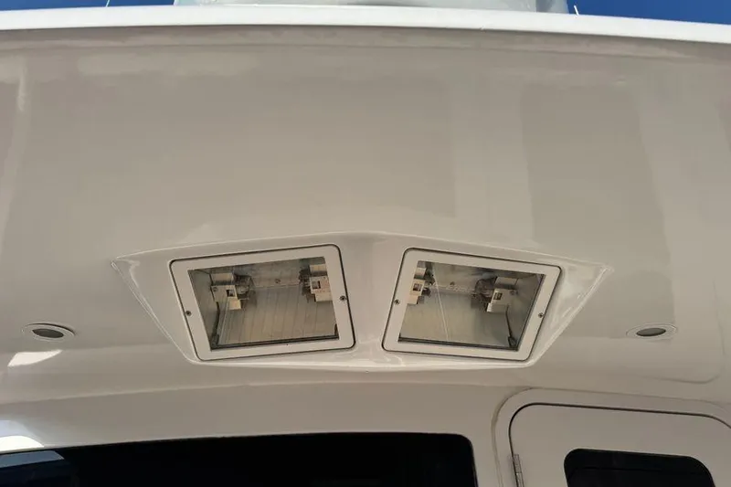 Slide: The Image of Ceiling view of 2002 Viking 61 Enclosed Bridge yacht with recessed lighting fixtures. - 29