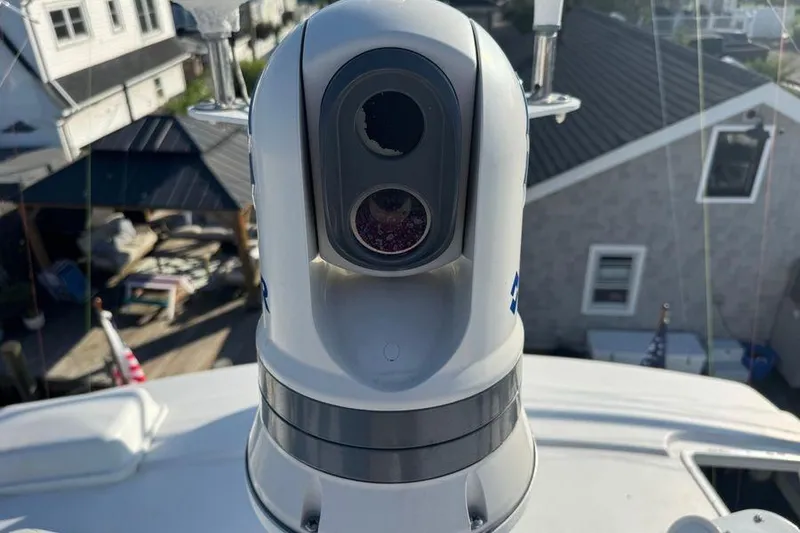 Slide: The Image of Close-up of a camera on a 2002 Viking 61 Enclosed Bridge yacht. - 33