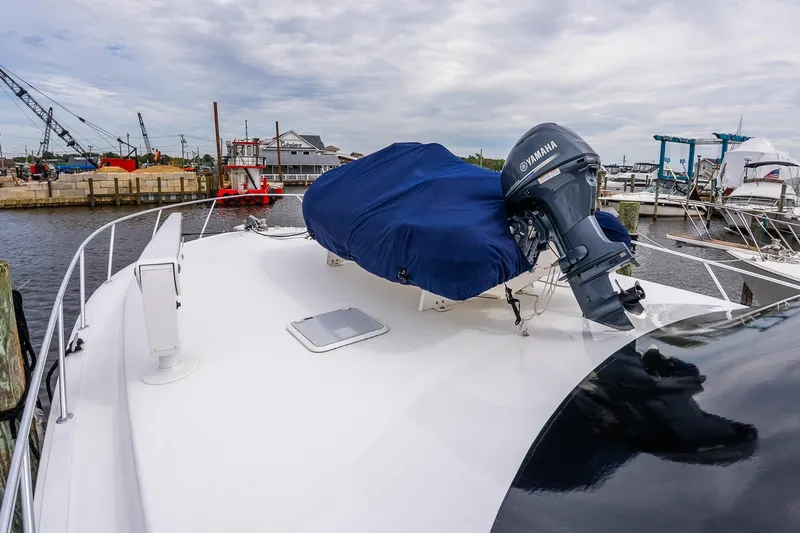 Slide: The Image of 2002 Viking 61 Enclosed Bridge yacht with Yamaha motor at marina. - 38