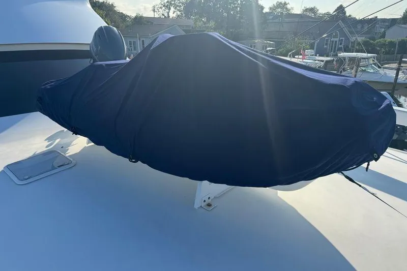 Slide: The Image of Covered equipment on 2002 Viking 61 Enclosed Bridge yacht deck, sunny day. - 39