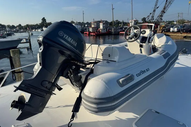 Slide: The Image of Inflatable boat with Yamaha motor on 2002 Viking 61 Enclosed Bridge yacht. - 42
