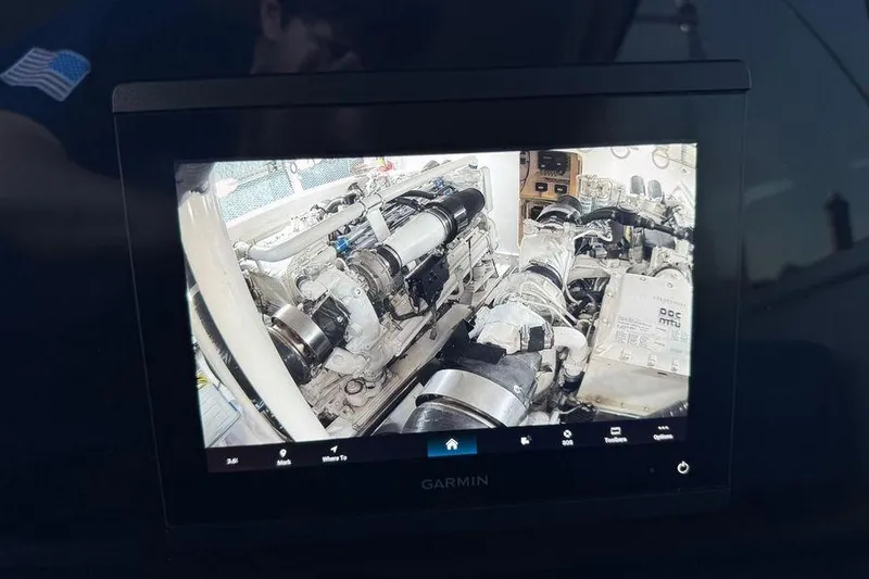 Slide: The Image of Garmin display showing engine room of 2002 Viking 61 Enclosed Bridge yacht. - 69