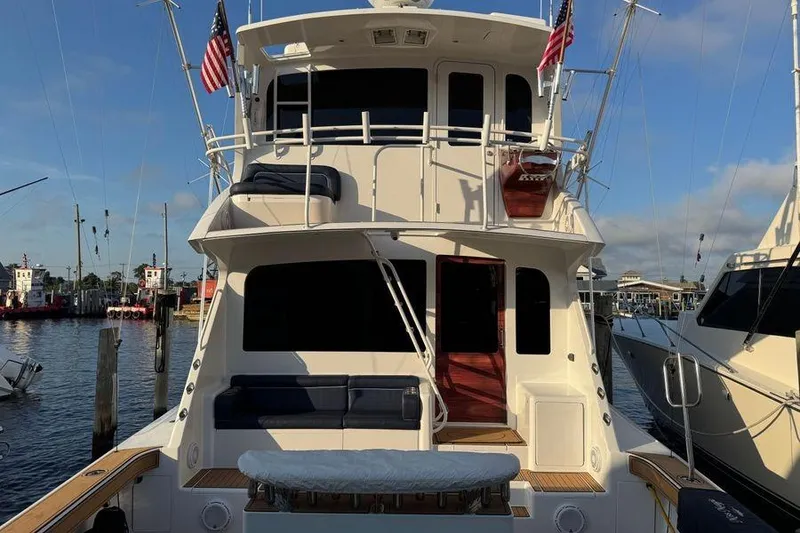Slide: The Image of 2002 Viking 61 Enclosed Bridge yacht docked at marina, rear view. - 7