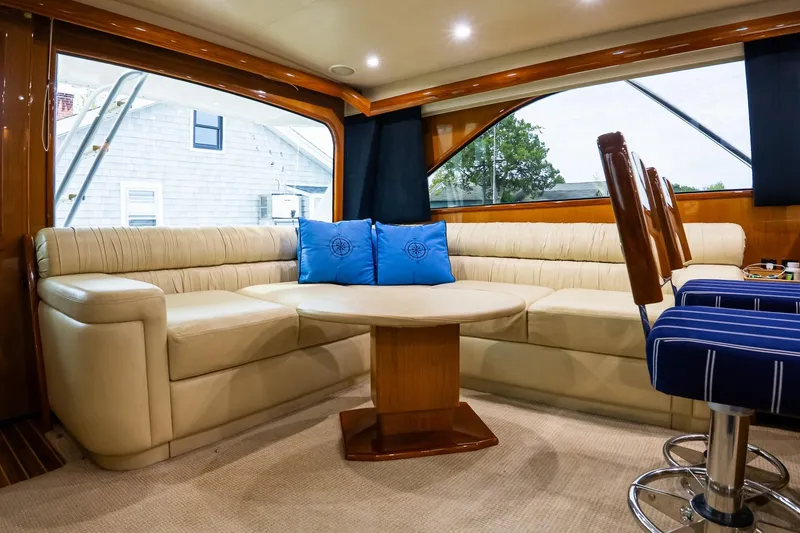 Slide: The Image of Luxurious interior of 2002 Viking 61 Enclosed Bridge yacht with plush seating and elegant decor. - 75