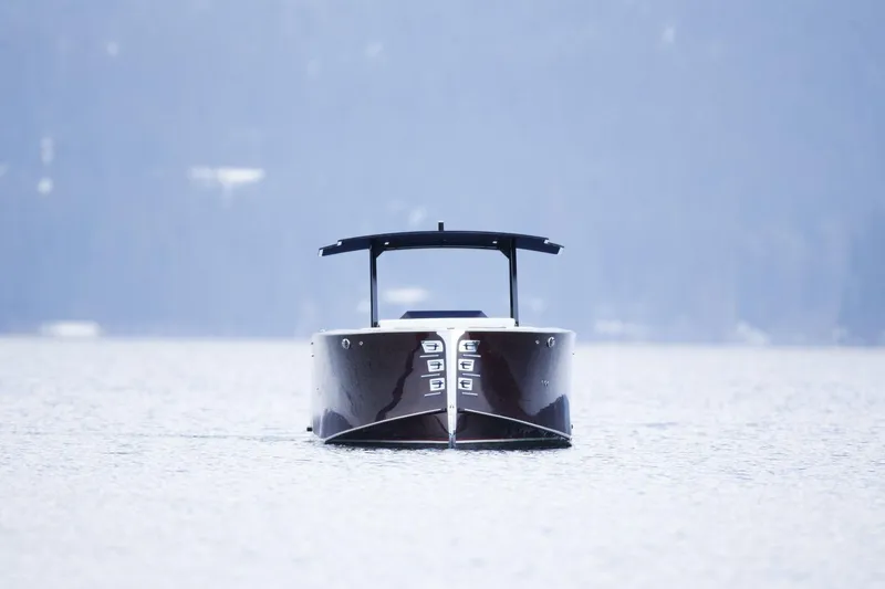 Slide: The Image of 2023 StanCraft 340 Hammerhead Center Console boat on calm water, front view. - 4